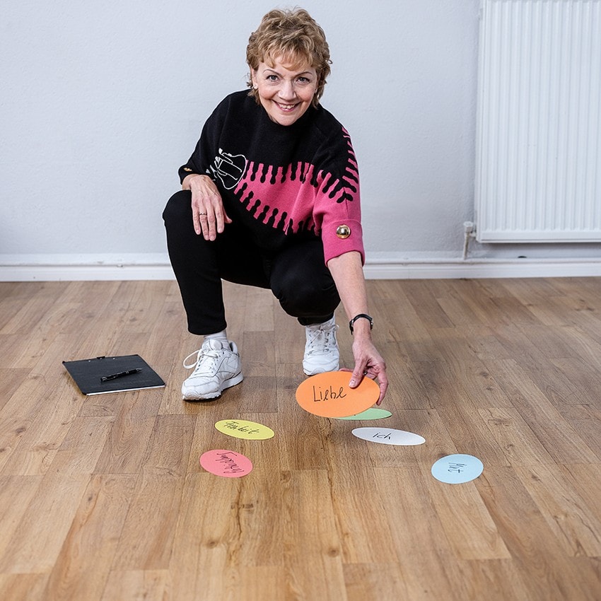 Renate Starke lays out floor anchor cards for a constellation