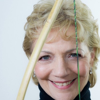 Renate Starke behind her longbow
